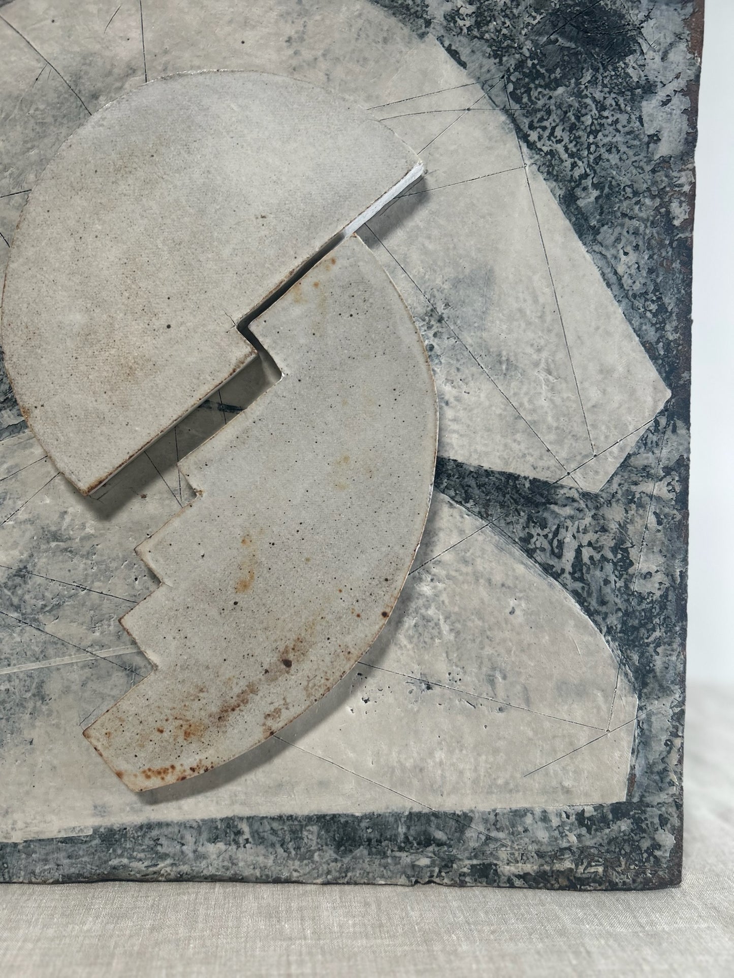 Decorative stone with a unique cut design on a marble surface