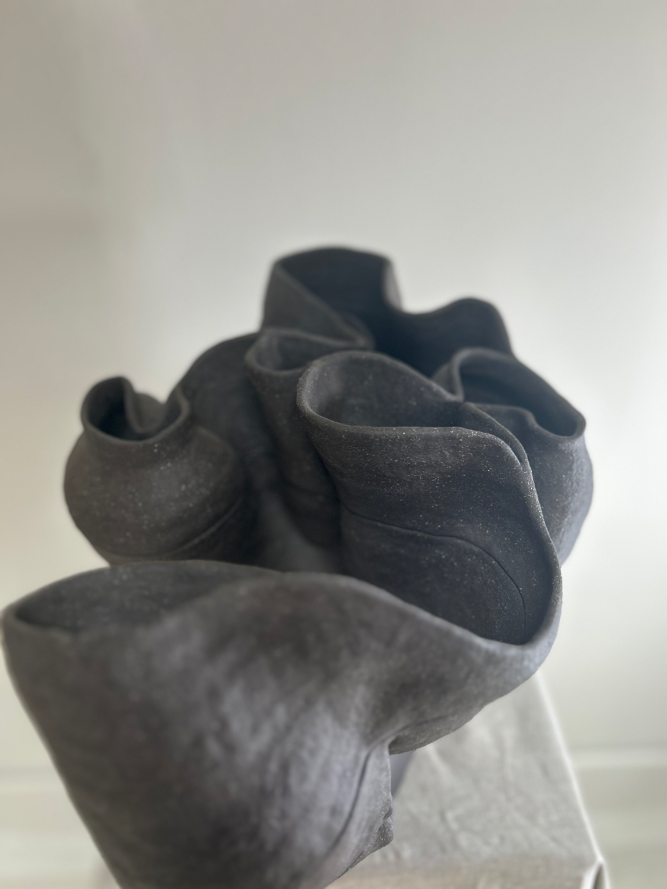 Dark gray fabric with a textured pattern on a white background